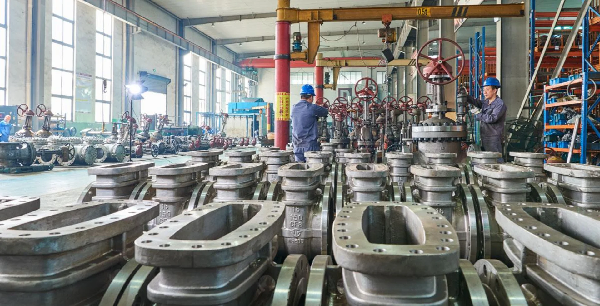 Industrial engineer examining pipeline valve